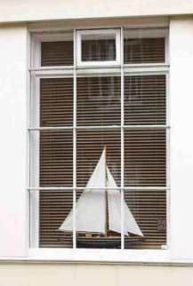 Model yacht in a window