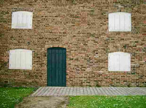 Building with boarded doors and windows