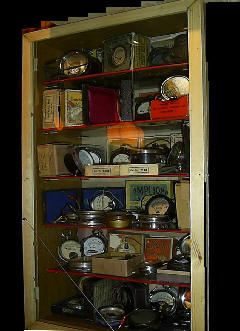 A cabinet of old radio meters