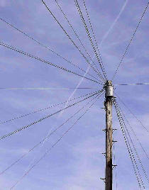 aircraft vapour trail and telephone wires
