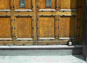 Oak door and steps with beer bottle