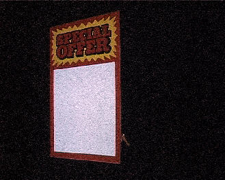 An advertising board with a woman's leg half showing